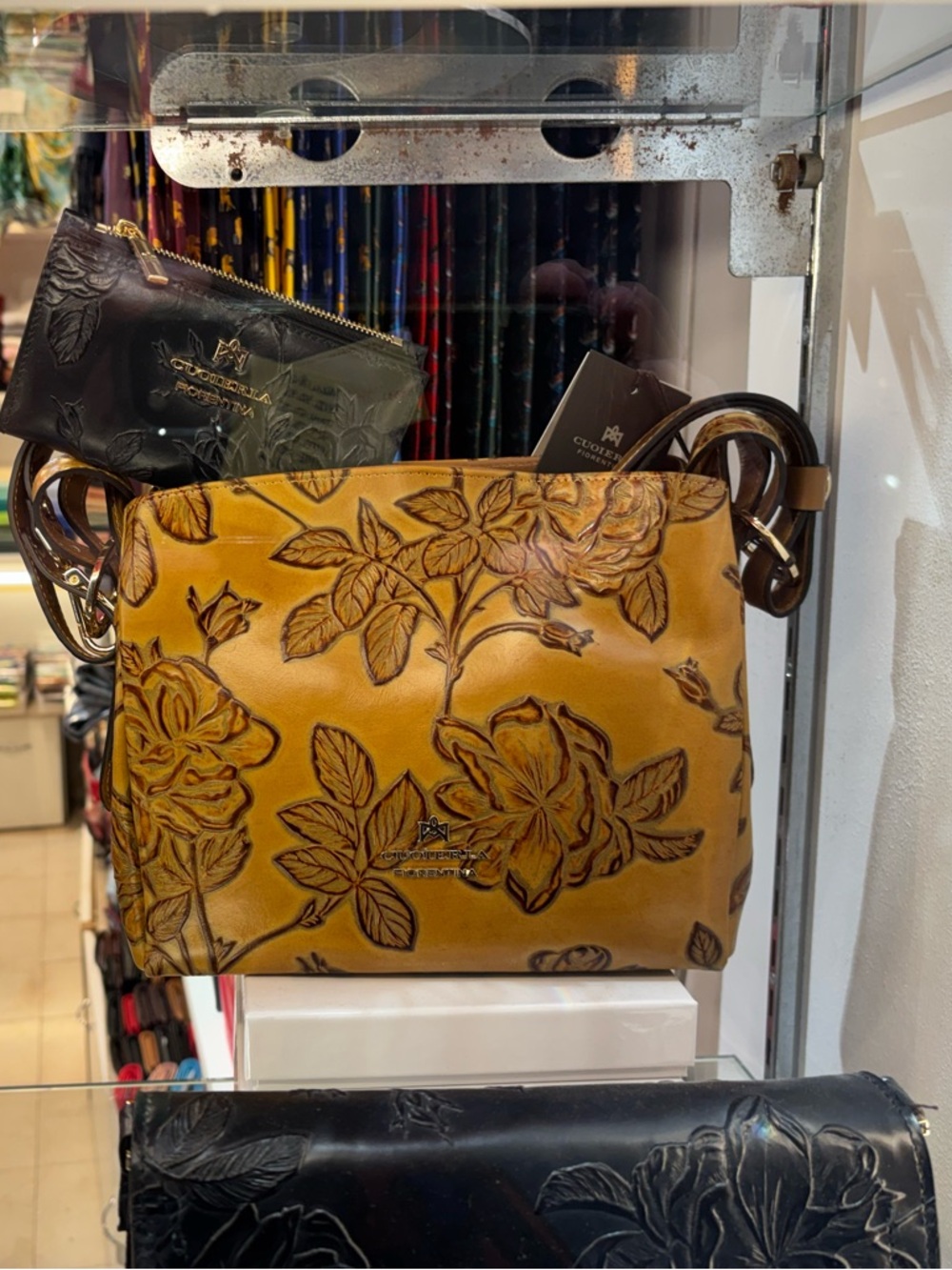 Floral-Embossed Tan Leather Crossbody with Tassel Accent